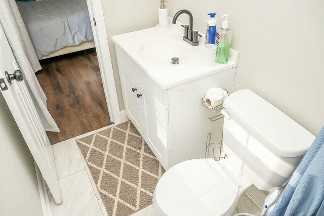 407 Tammie Ave, Goose Creek, SC 29445 - half bathroom featuring toilet, vanity, and wood finished floors