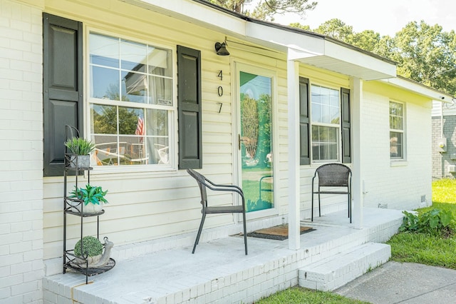 407 Tammie Ave, Goose Creek, SC 29445 - view of exterior entry with crawl space, covered porch, and brick siding