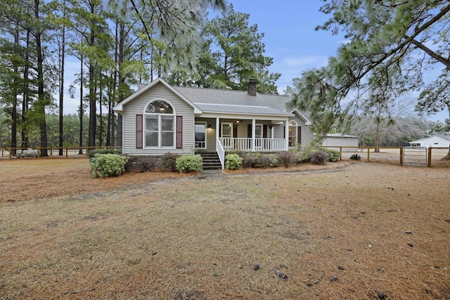 ranch-style house featuring covered porch