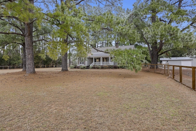 view of yard with covered porch