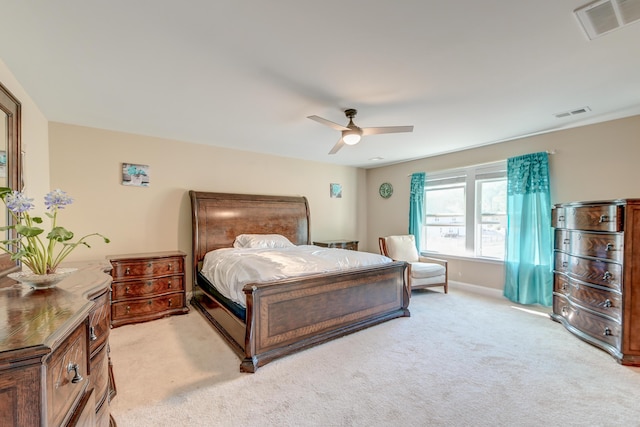 bedroom featuring light colored carpet and ceiling fan