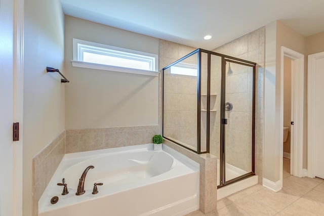 bathroom with toilet, shower with separate bathtub, and tile patterned floors