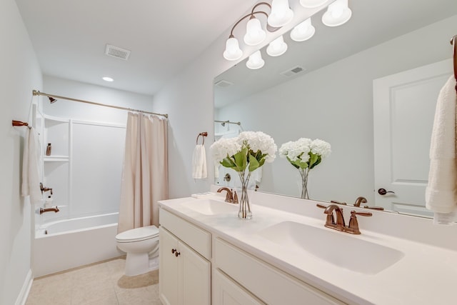 full bathroom featuring tile patterned flooring, vanity, toilet, and shower / bath combo with shower curtain