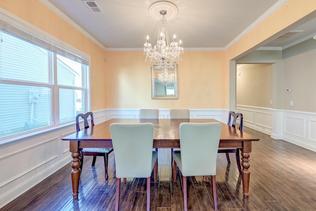 dining area with a notable chandelier, crown molding, and dark wood-type flooring