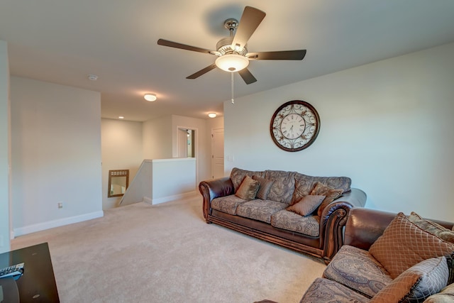 living room with ceiling fan and light carpet