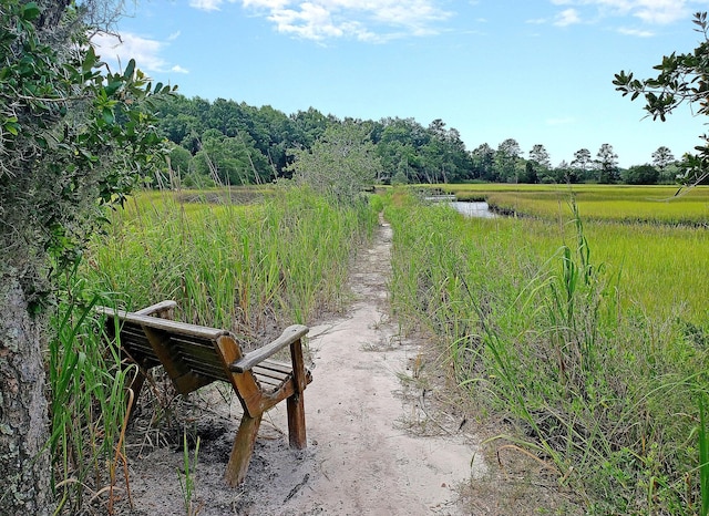 surrounding community with a water view