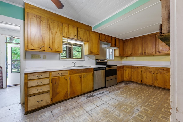 kitchen with light countertops, stainless steel appliances, and brown cabinetry