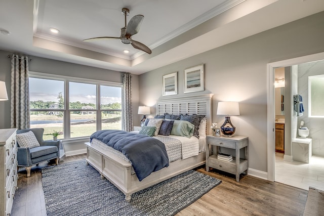 451 White Magnolia St, Moncks Corner, SC 29461 - bedroom featuring ornamental molding, a raised ceiling, wood finished floors, baseboards, and ensuite bathroom