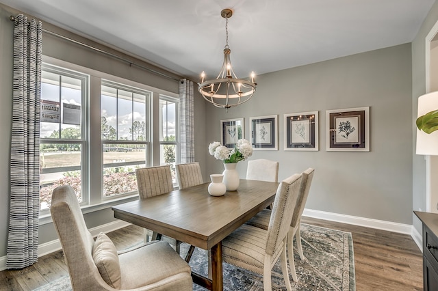 451 White Magnolia St, Moncks Corner, SC 29461 - dining area with a chandelier, dark wood finished floors, and baseboards