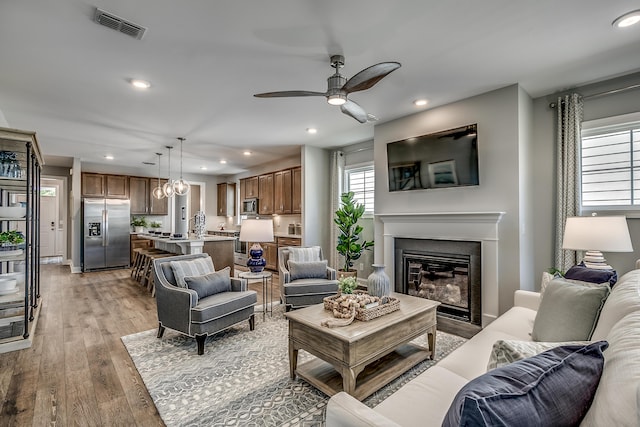 451 White Magnolia St, Moncks Corner, SC 29461 - living area with a ceiling fan, a glass covered fireplace, light wood-style floors, and recessed lighting