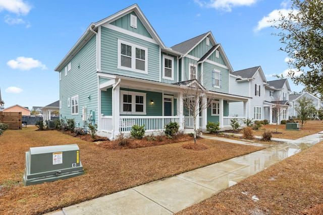 view of front of property with a porch and central AC unit