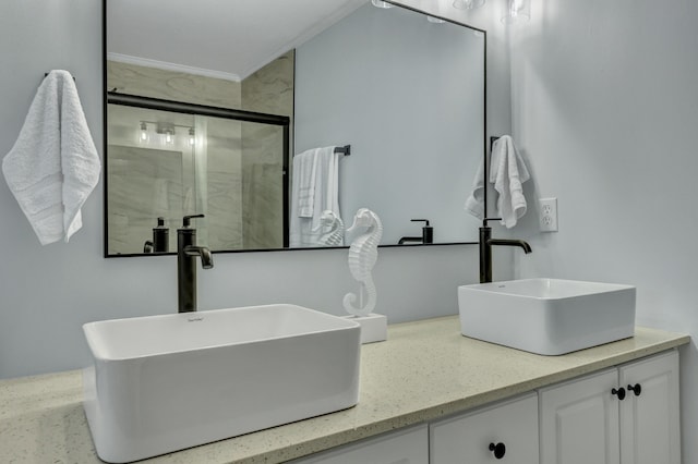 bathroom featuring vanity and a shower with shower door