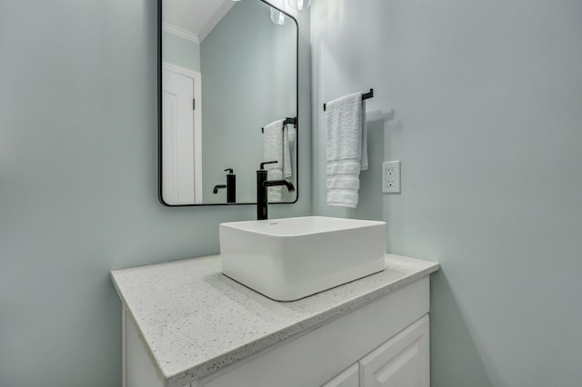 bathroom featuring vanity and crown molding