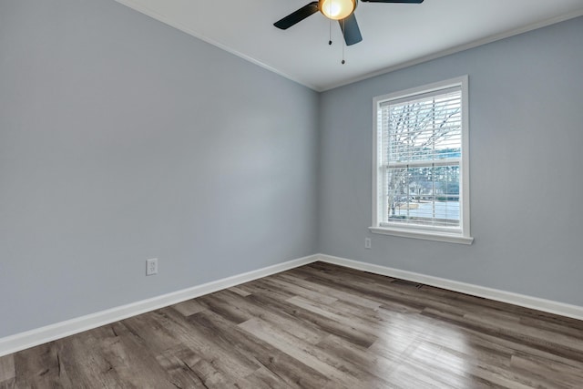 empty room featuring hardwood / wood-style flooring, ceiling fan, and ornamental molding