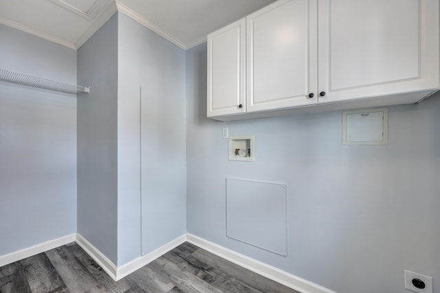 laundry area with crown molding, dark wood-type flooring, cabinets, washer hookup, and hookup for an electric dryer