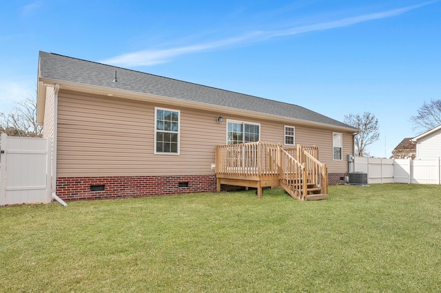 rear view of house featuring central AC, a lawn, and a deck