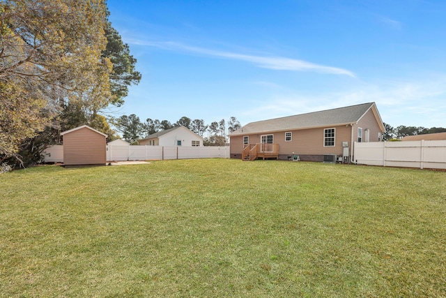 view of yard featuring a deck and a shed