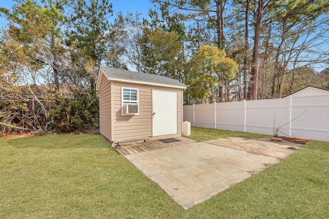 view of outbuilding featuring a yard and cooling unit