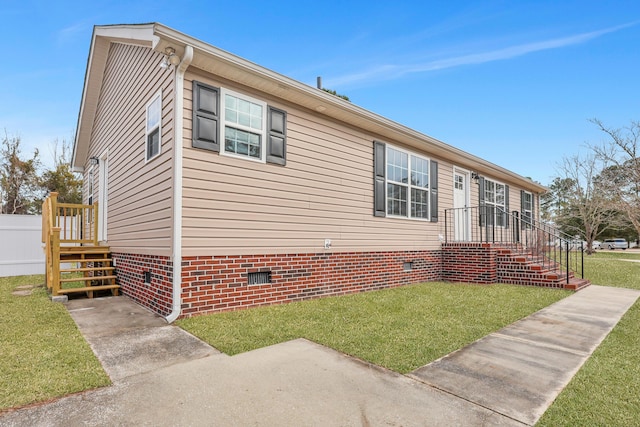 view of property exterior featuring a yard