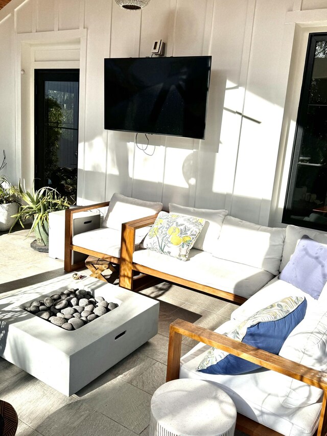 living room featuring wood walls