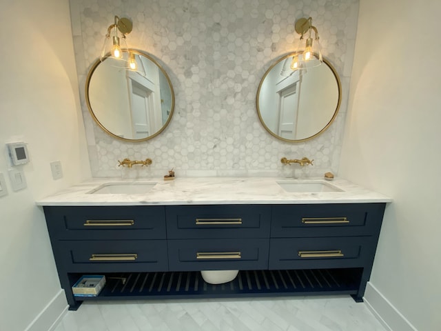 bathroom featuring tasteful backsplash and vanity