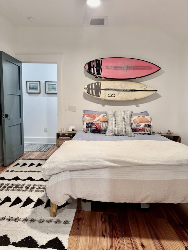 bedroom featuring wood-type flooring