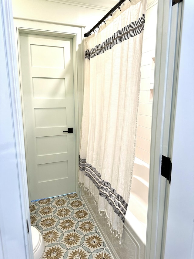 bathroom featuring tile patterned floors and toilet