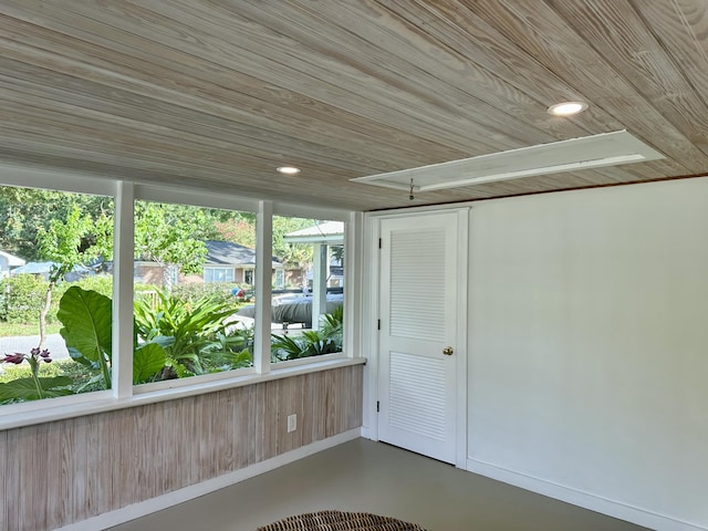 unfurnished sunroom featuring wood ceiling