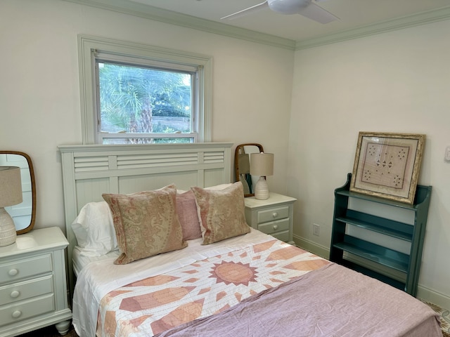 bedroom with ceiling fan and ornamental molding