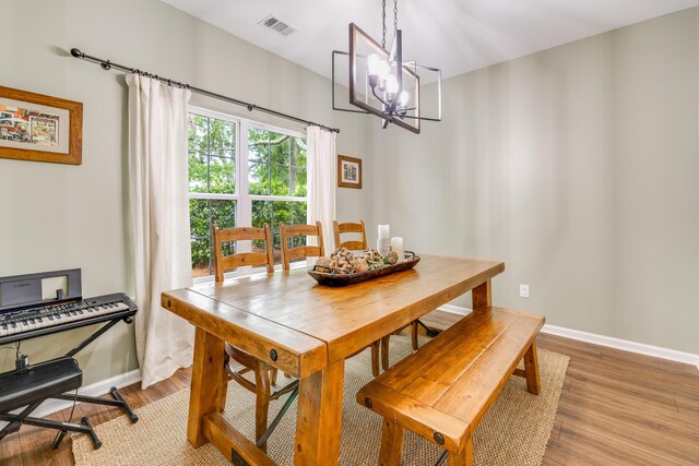 261 Mossy Oak Way, Mount Pleasant, SC 29464 - dining area with a chandelier, light wood finished floors, and baseboards