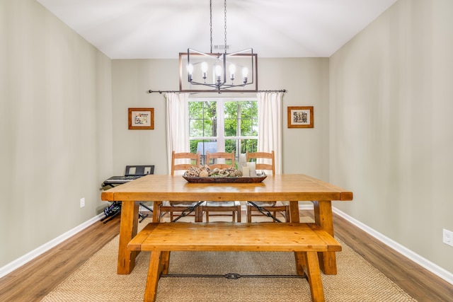 261 Mossy Oak Way, Mount Pleasant, SC 29464 - dining area with a chandelier, wood finished floors, and baseboards