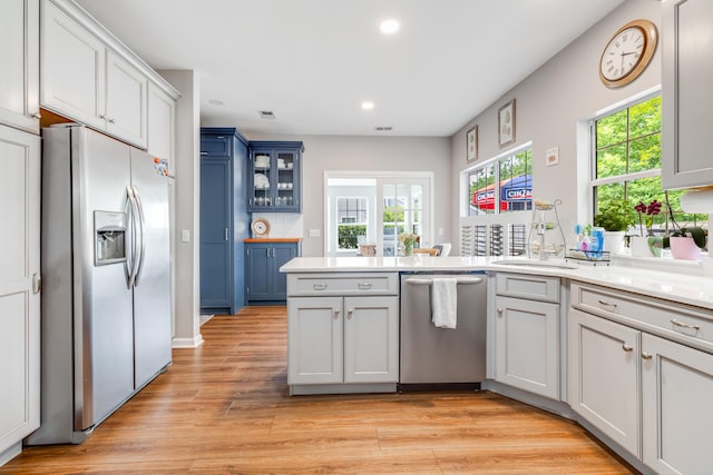 261 Mossy Oak Way, Mount Pleasant, SC 29464 - kitchen with appliances with stainless steel finishes, a peninsula, a sink, recessed lighting, and plenty of natural light