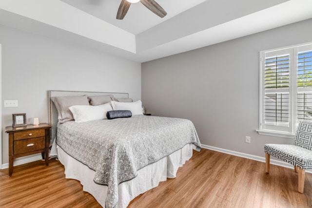 261 Mossy Oak Way, Mount Pleasant, SC 29464 - bedroom featuring light wood-style floors, baseboards, ceiling fan, and a raised ceiling