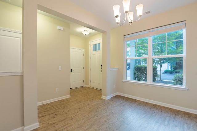 5001 Hay Bale Ct, Summerville, SC 29485 - foyer with light wood-style flooring, a chandelier, and baseboards