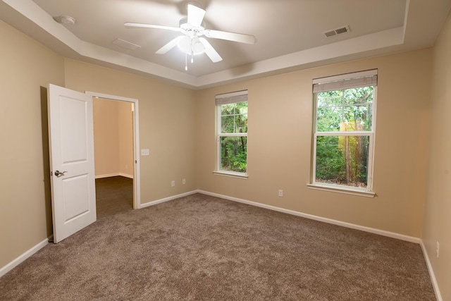 5001 Hay Bale Ct, Summerville, SC 29485 - spare room featuring a tray ceiling, a smoke detector, carpet floors, and ceiling fan
