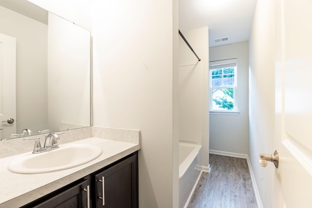 5001 Hay Bale Ct, Summerville, SC 29485 - bathroom with wood finished floors, vanity, and baseboards