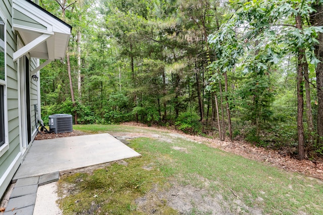 5001 Hay Bale Ct, Summerville, SC 29485 - view of green lawn featuring a patio area, central AC unit, and a view of trees