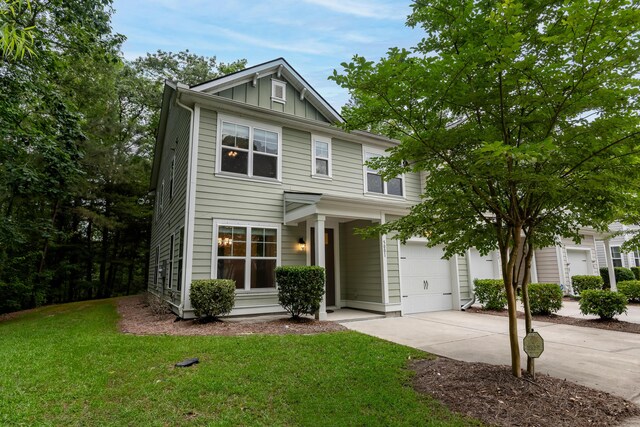 5001 Hay Bale Ct, Summerville, SC 29485 - view of front of property featuring board and batten siding, driveway, and a front yard