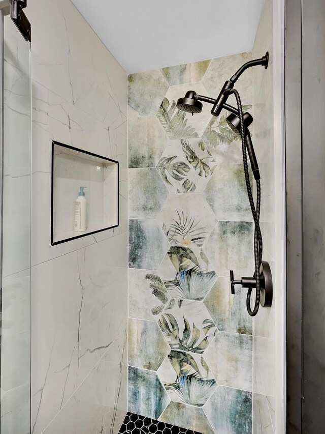 bathroom view of tiled shower