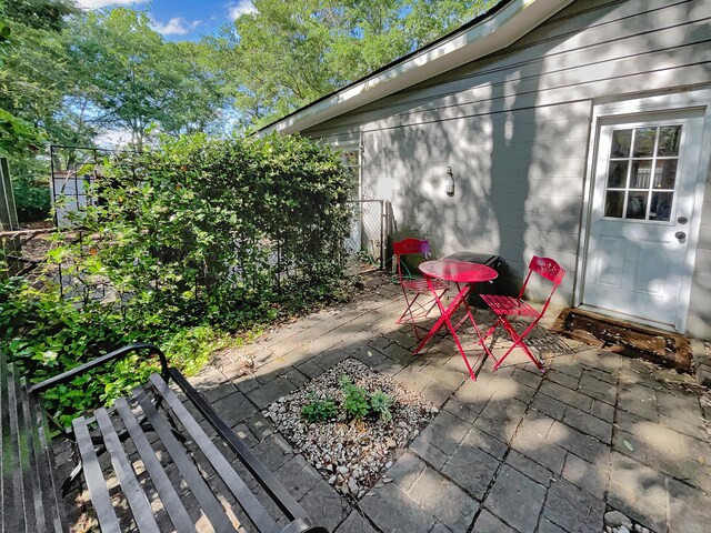 view of patio featuring fence