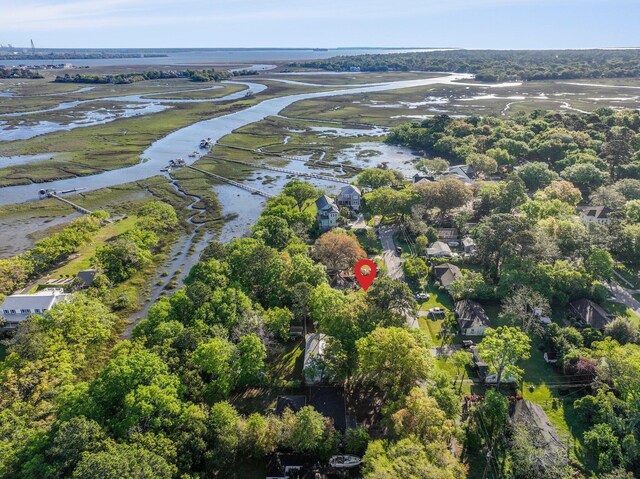aerial view of property's location with a large body of water