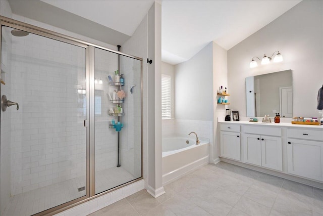 bathroom with a bath, a stall shower, vanity, and vaulted ceiling