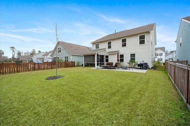 rear view of house featuring a fenced backyard, a lawn, cooling unit, and a patio