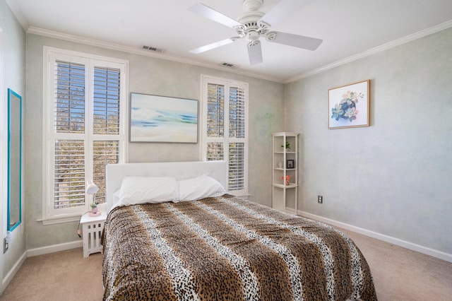 carpeted bedroom featuring ceiling fan and ornamental molding