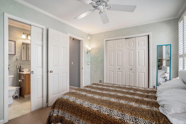 bedroom featuring crown molding, light colored carpet, ceiling fan, and a closet