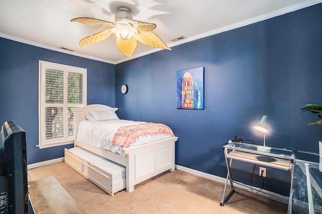 bedroom with ornamental molding, light colored carpet, and ceiling fan