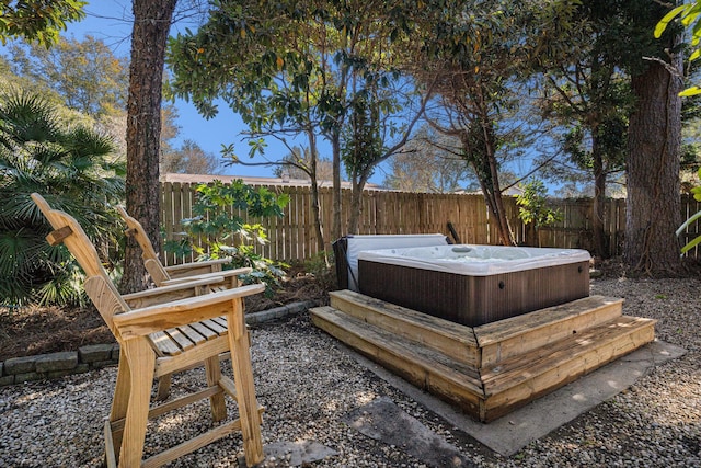 view of yard with a hot tub