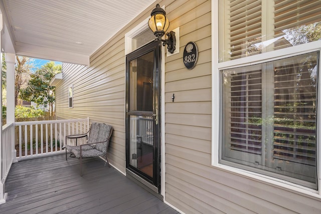 wooden terrace with a porch