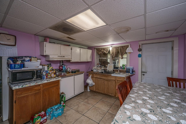 1265 Trojan Rd 1269 1271, 1273, Cross, SC 29436 - kitchen featuring stainless steel microwave, light tile patterned floors, light countertops, a paneled ceiling, and white cabinets