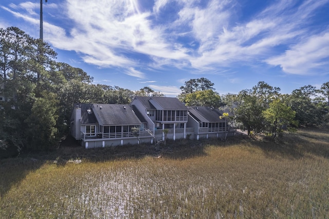 back of house featuring a sunroom